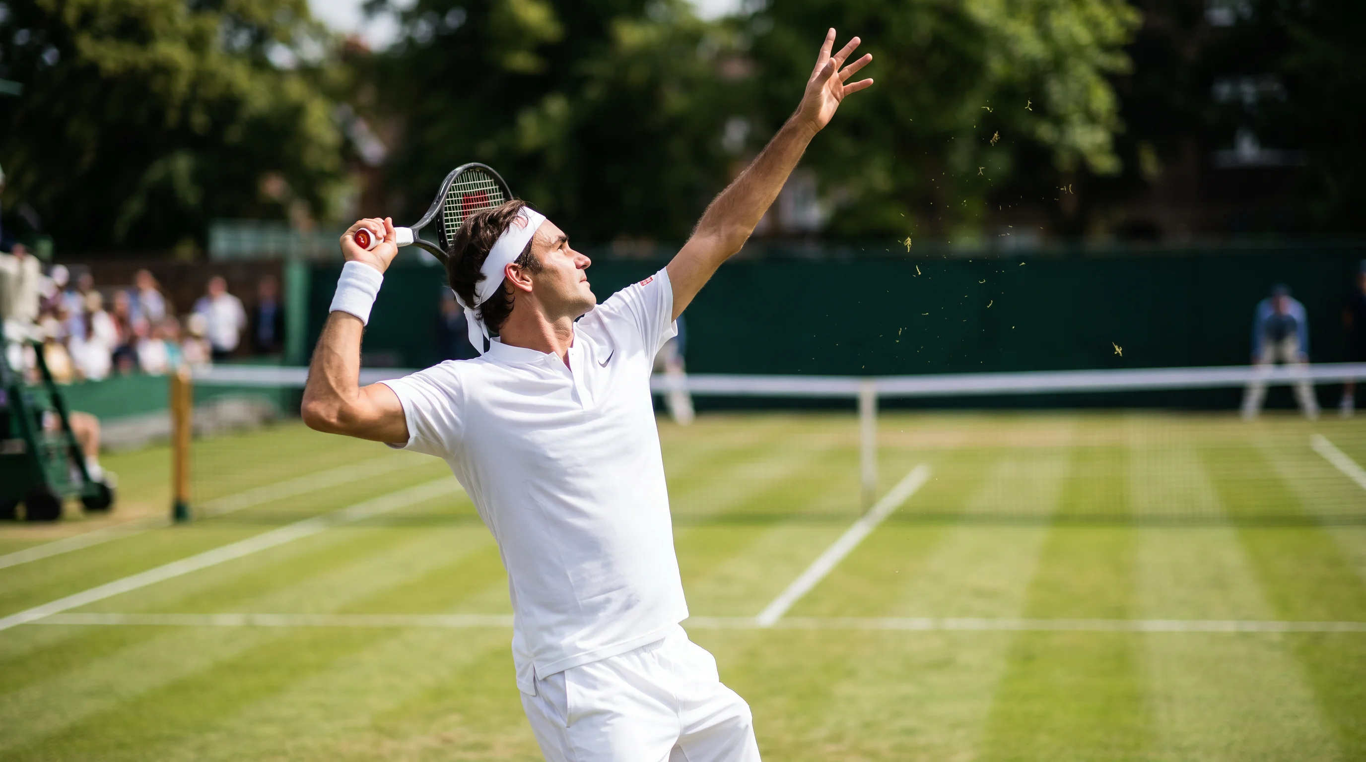 Tennis player serving on grass court at Queen's Club during pre-Wimbledon warm-up tournament